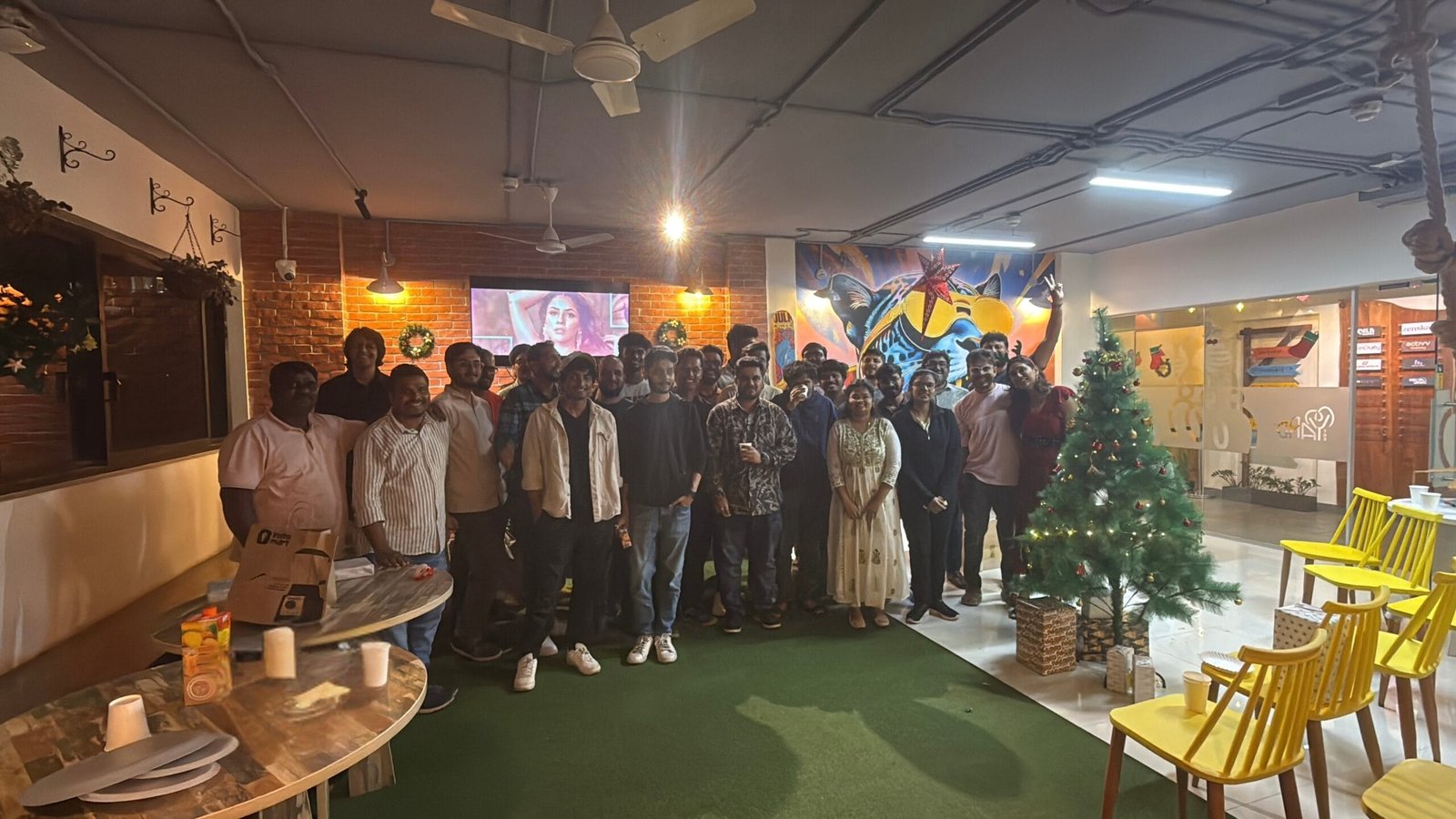 The Yard Coworking Space Indiranagar Bangalore Christmas celebration with members, festive decor, and a decorated Christmas tree