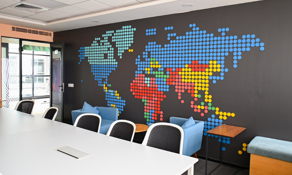 Modern coworking meeting room reflecting Coworking Design Trends with creative wall design and collaborative workspace at The Yard