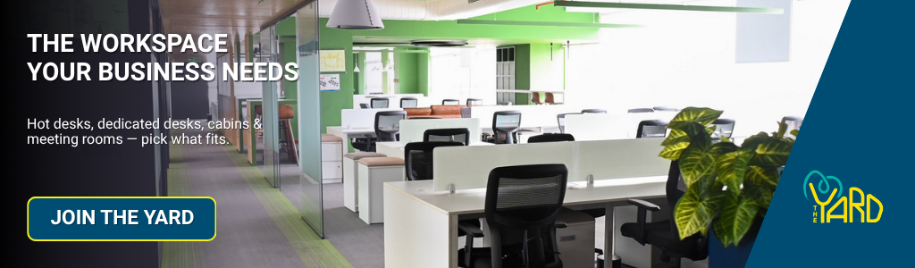 Modern office layout with flexible desks and seating in a professional coworking community workspace
