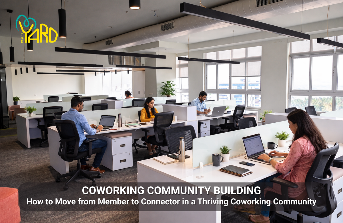 Professionals working in a modern coworking community open workspace showing collaboration and productivity