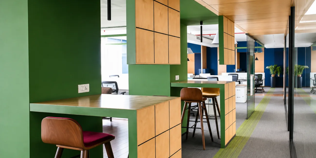 SEO-friendly alt text: Modern coworking space with professionals working on laptops at wooden desks