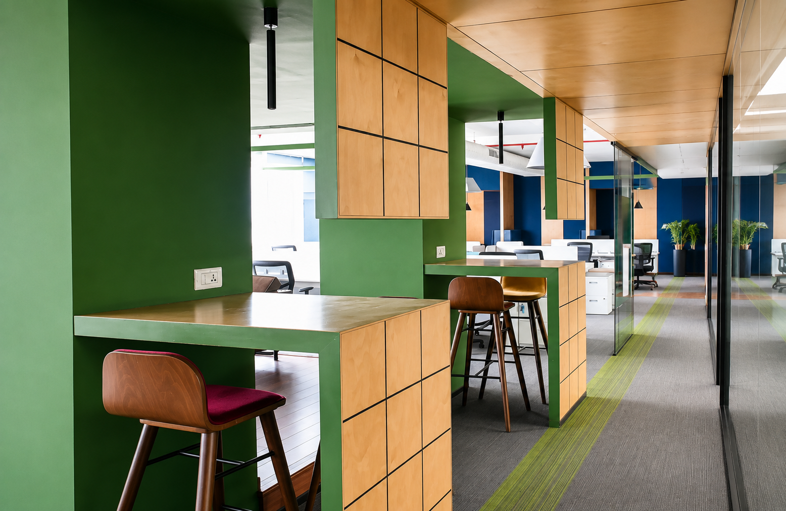 SEO-friendly alt text: Modern coworking space with professionals working on laptops at wooden desks